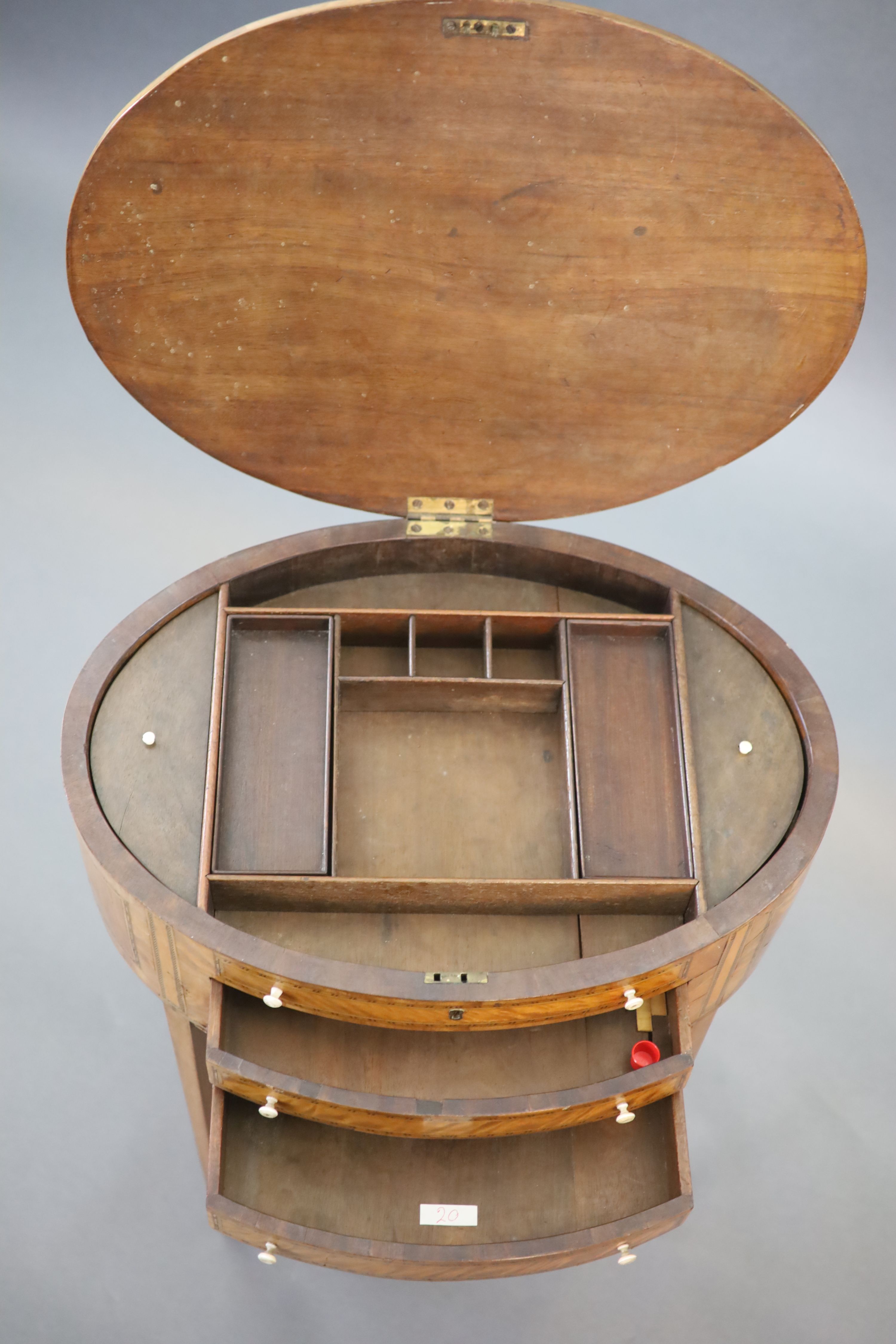 A George III rosewood banded satinwood oval work table, W.54.5cm D.39cm H.70cm